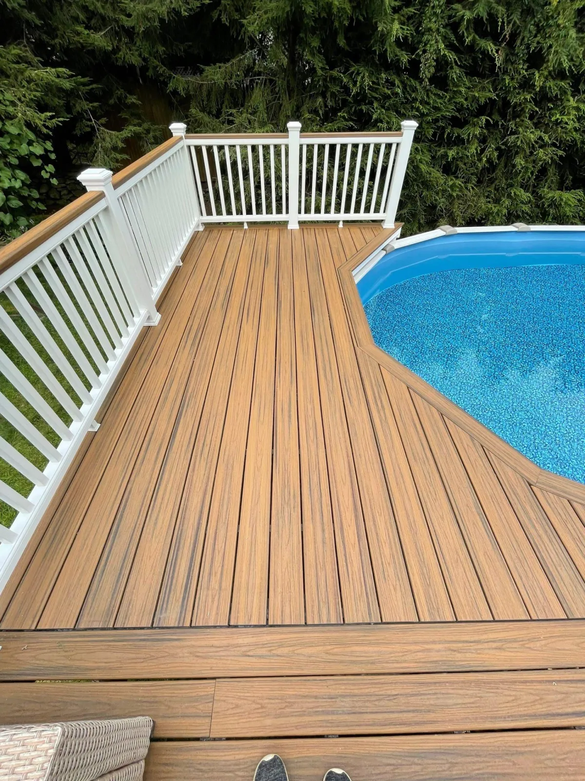 a newly installed deck beside the swimming pool