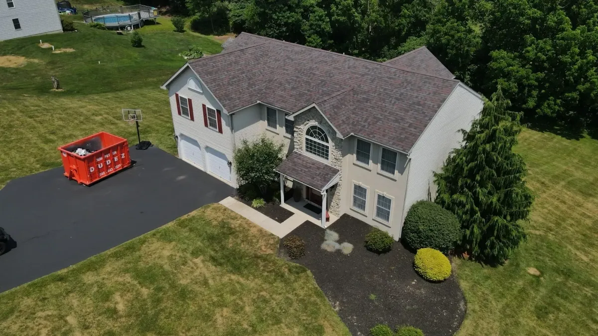 a big house with white siding