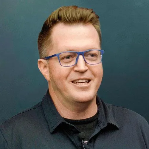 Headshot photograph of Luke Reynolds