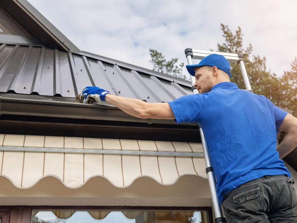 Seamless aluminum gutters installed along roofline of a Lewisville home