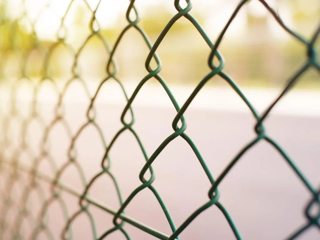 Decorative black metal fence with arched top design