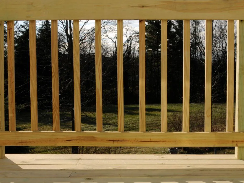 Custom wood deck stairs with safety handrails