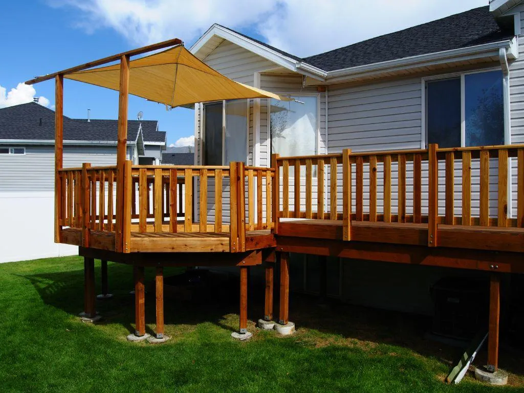 Custom-built composite deck with stairs and railing in Little Elm