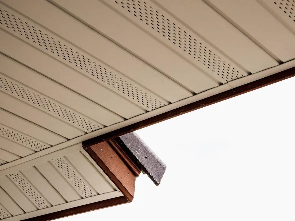 Freshly installed aluminum soffit panels on home exterior