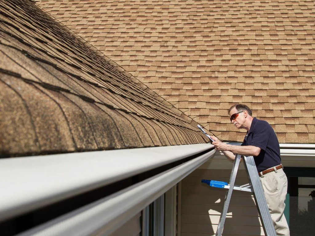 White seamless aluminum gutters along roofline and fascia