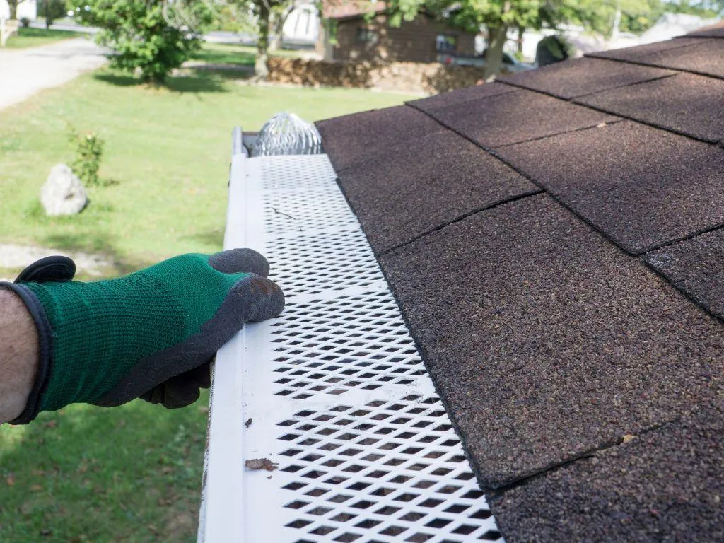 Mesh gutter guard installed to prevent leaf buildup