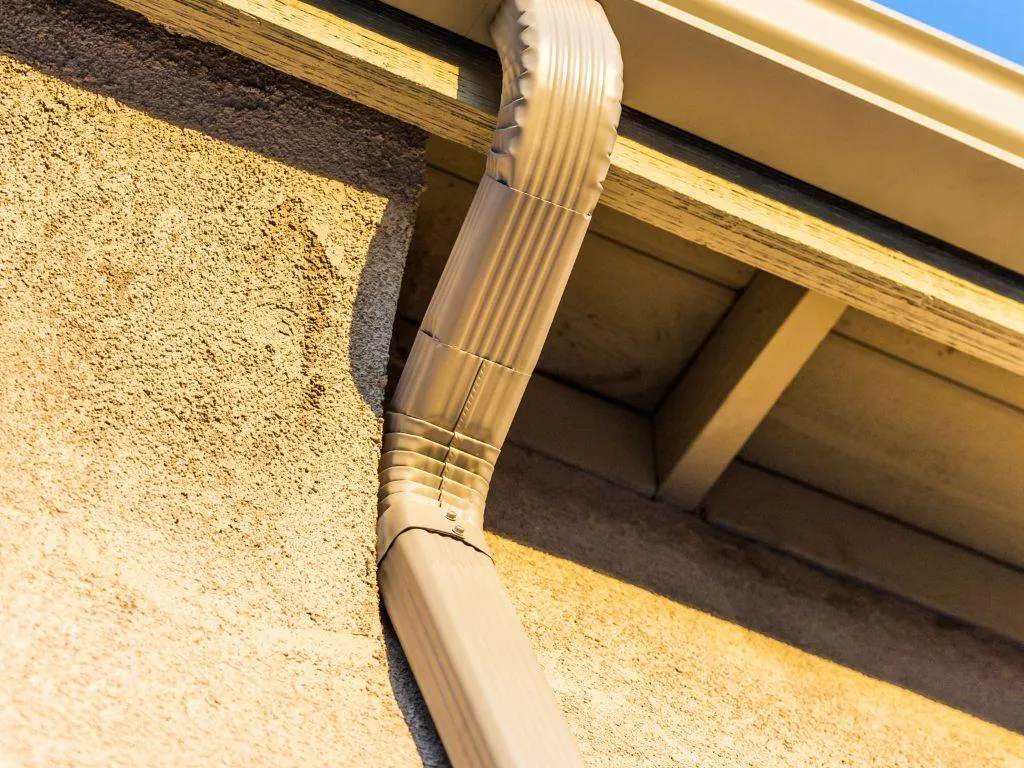 New downspout extension directing water away from foundation