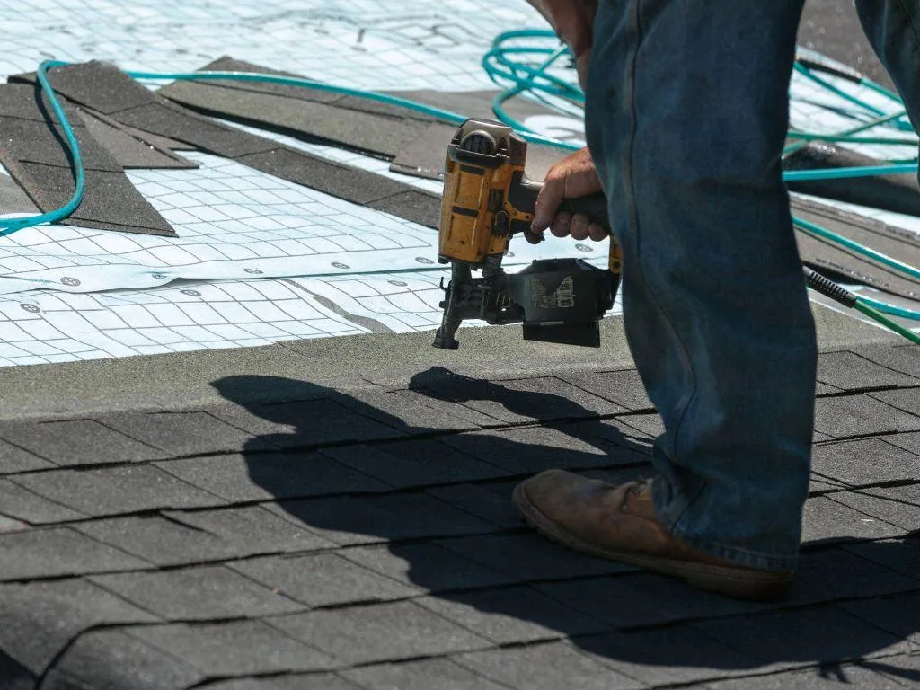 Architectural shingles being installed on residential roof