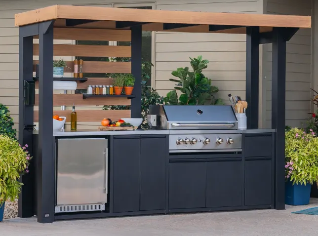 woman in black tank top and blue denim shorts standing on rocky mountain during daytime