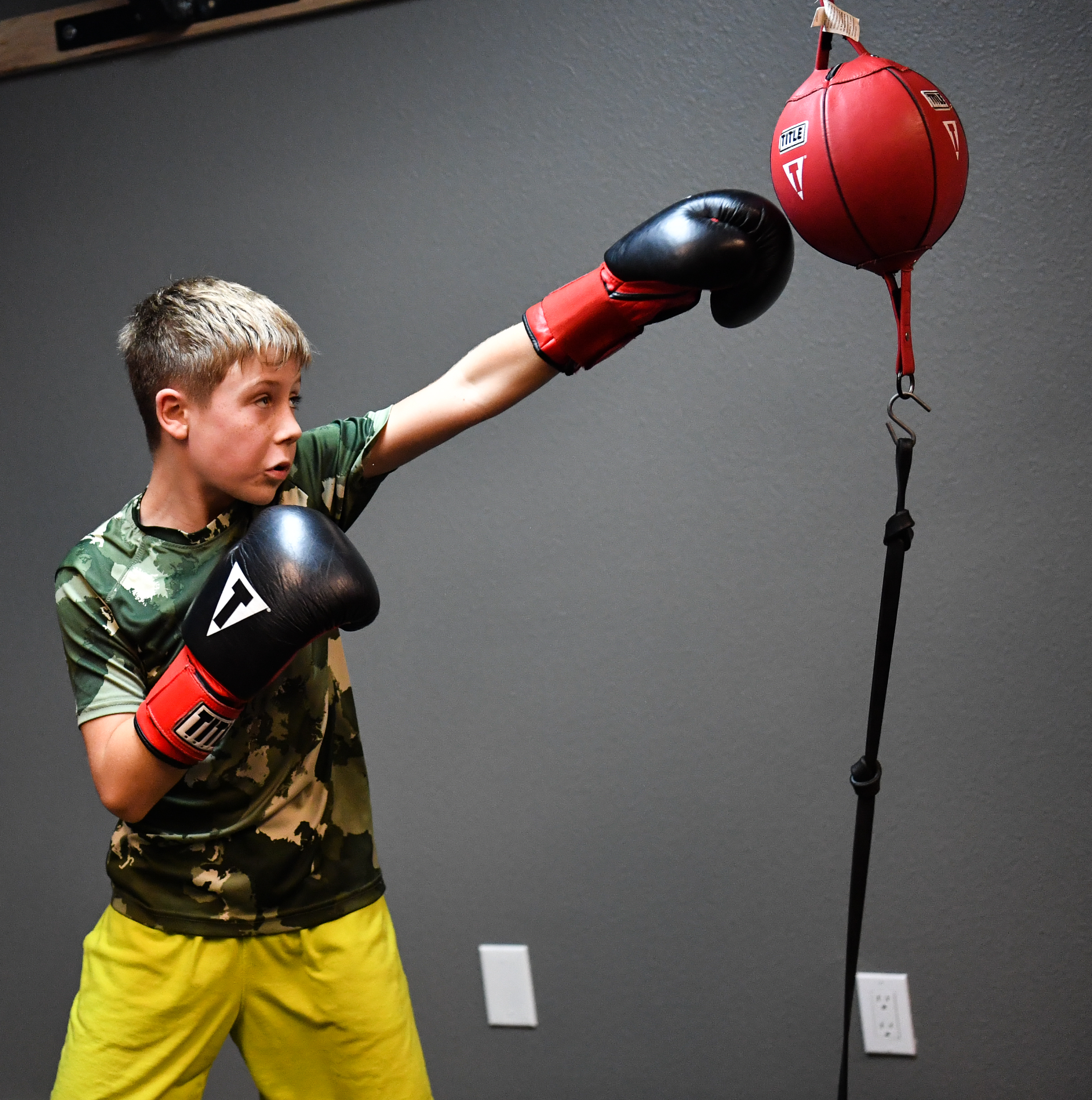 Youth boxer does technical boxing drills at knockout cancer boxing club in Fort Collins
