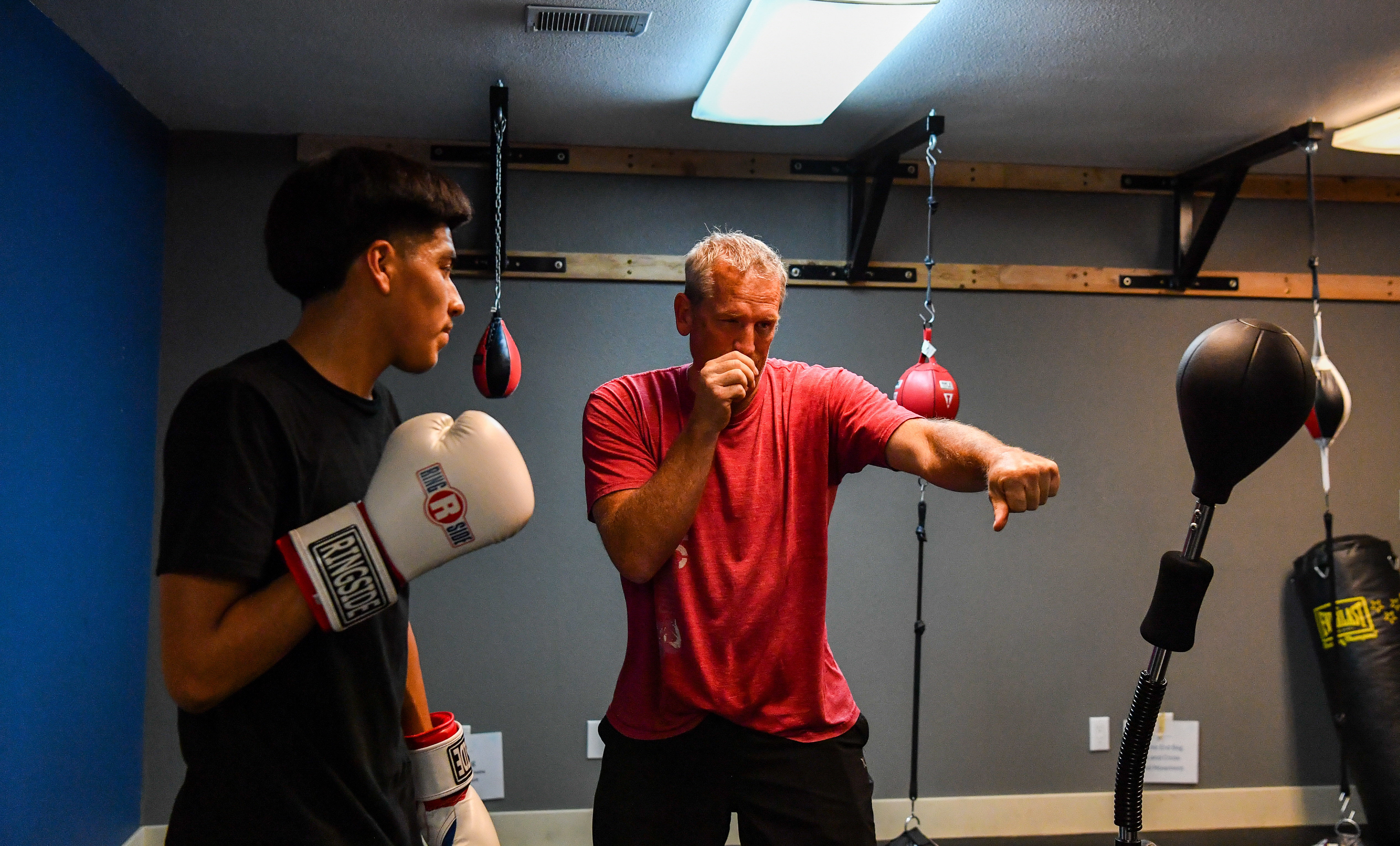 Fort Collins Boxing Coach Giving a One on One Lesson to a youth boxer