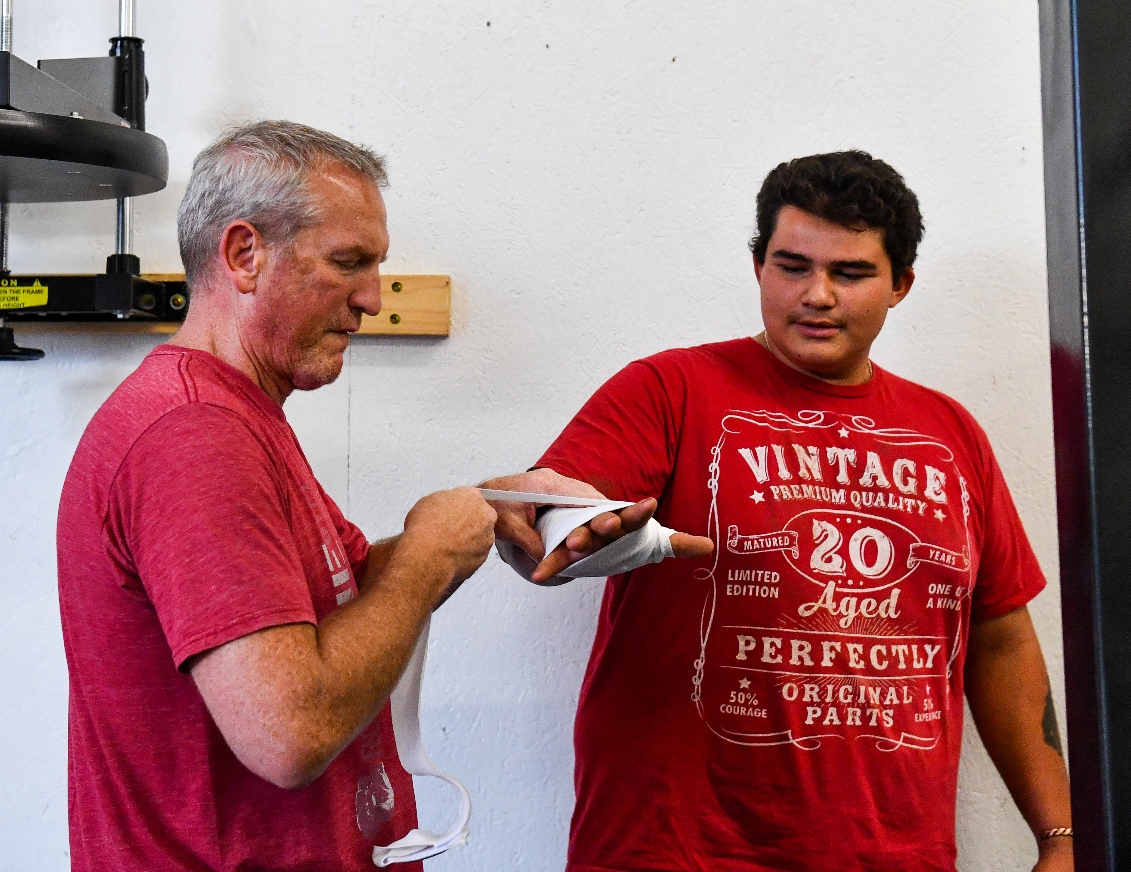 Fort Collins Boxing Head Coach Shane Wrapping The hands of a local boxing student