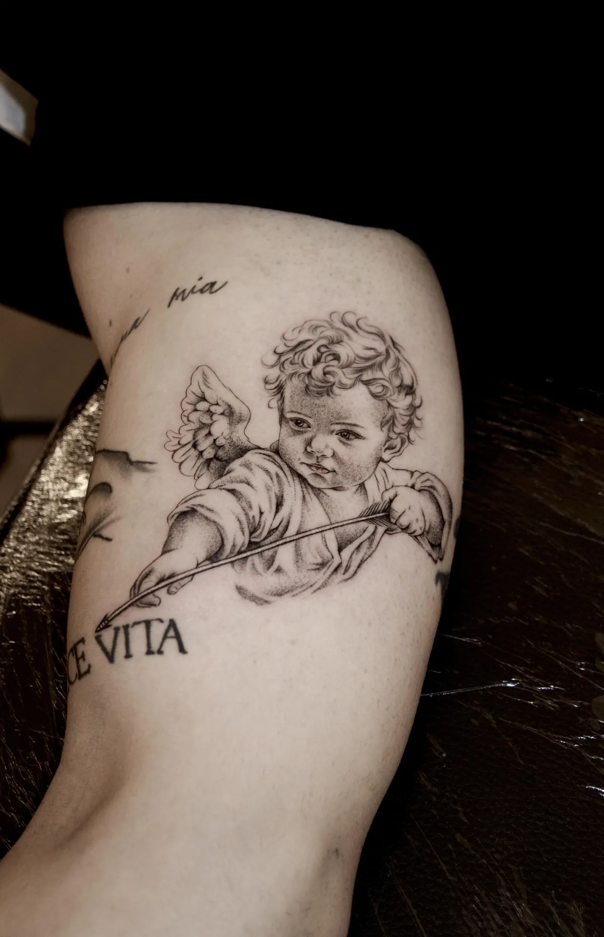 person with tattoo on right arm