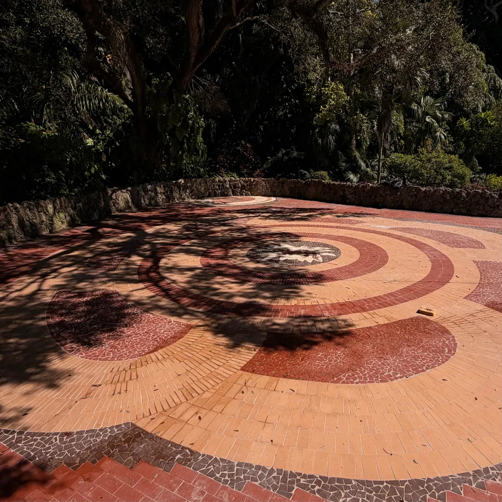 a kitchen with a center island with four bar stools