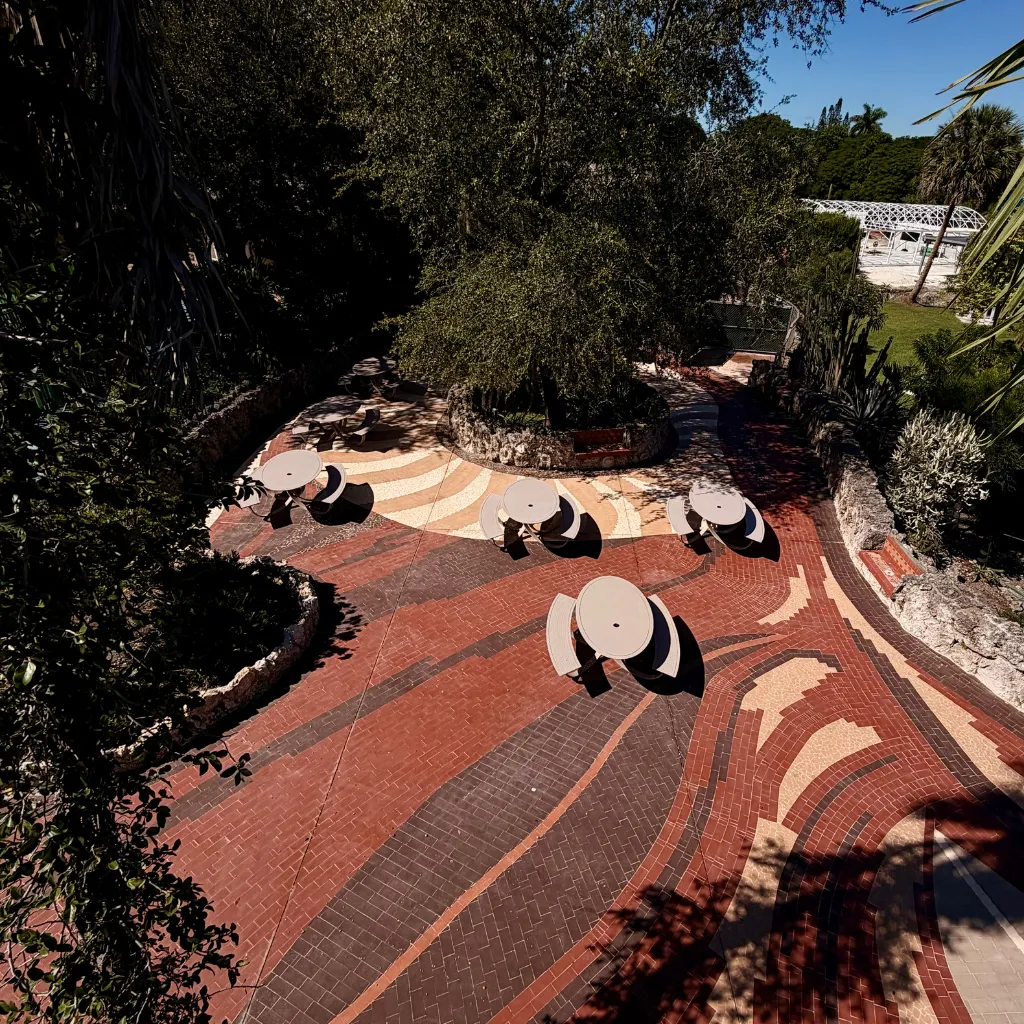 a kitchen with a center island with four bar stools