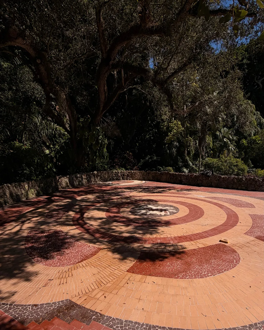 a kitchen with a center island with four bar stools