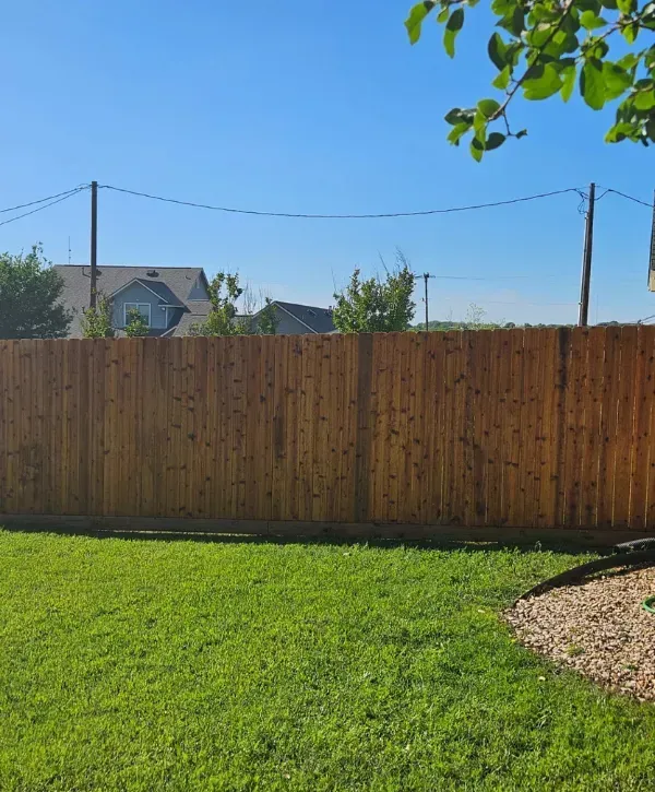 Backyard wood privacy fence installation in College Station TX