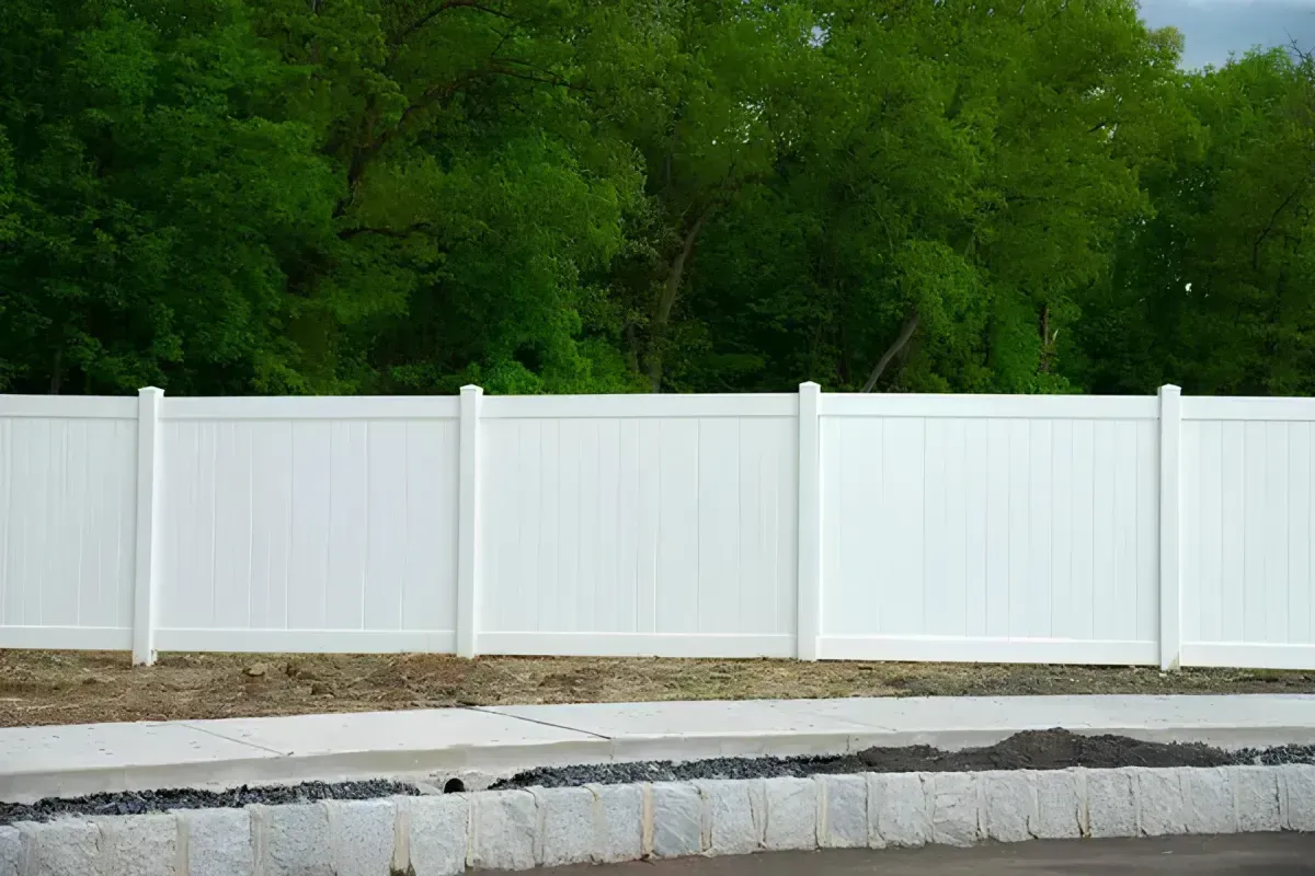 White vinyl fence providing clean, modern privacy.