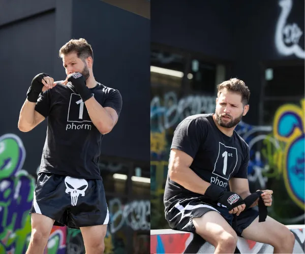 Paul Puleo, owner of Fight Fit and private martial arts instructor, seen in a fighting stance and sitting while wrapping his gloves. Personal trainer specializing in martial arts.