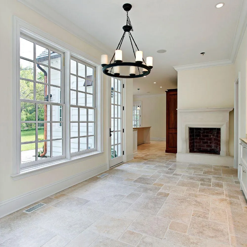 Stock photo of natural stone tile flooring in bright living space, Charlotte NC