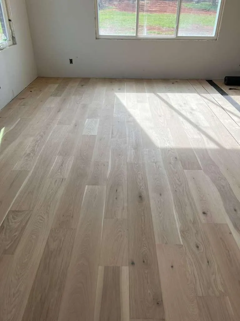 New light hardwood floor installation in Charlotte NC bedroom