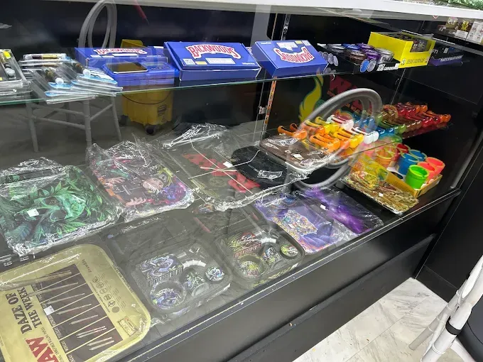 a person sitting on a couch holding a cigarette