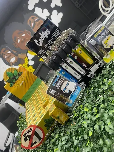 three cigar beside cutter on ashtray