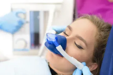 Patient receiving nitrous dental sedation through a mask by Celina Texas dentist at Open Late Dental and Orthodontics