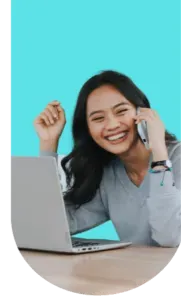Woman holding a phone booking a dental appointment with a Celina Texas dentist at Open Late Dental and Orthodontics for convenient scheduling