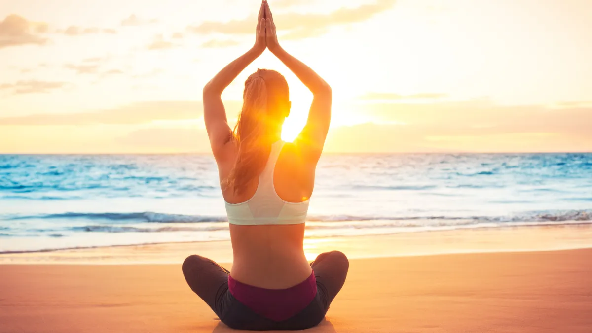 Yoga on the beach in Mauritius at sunrise
