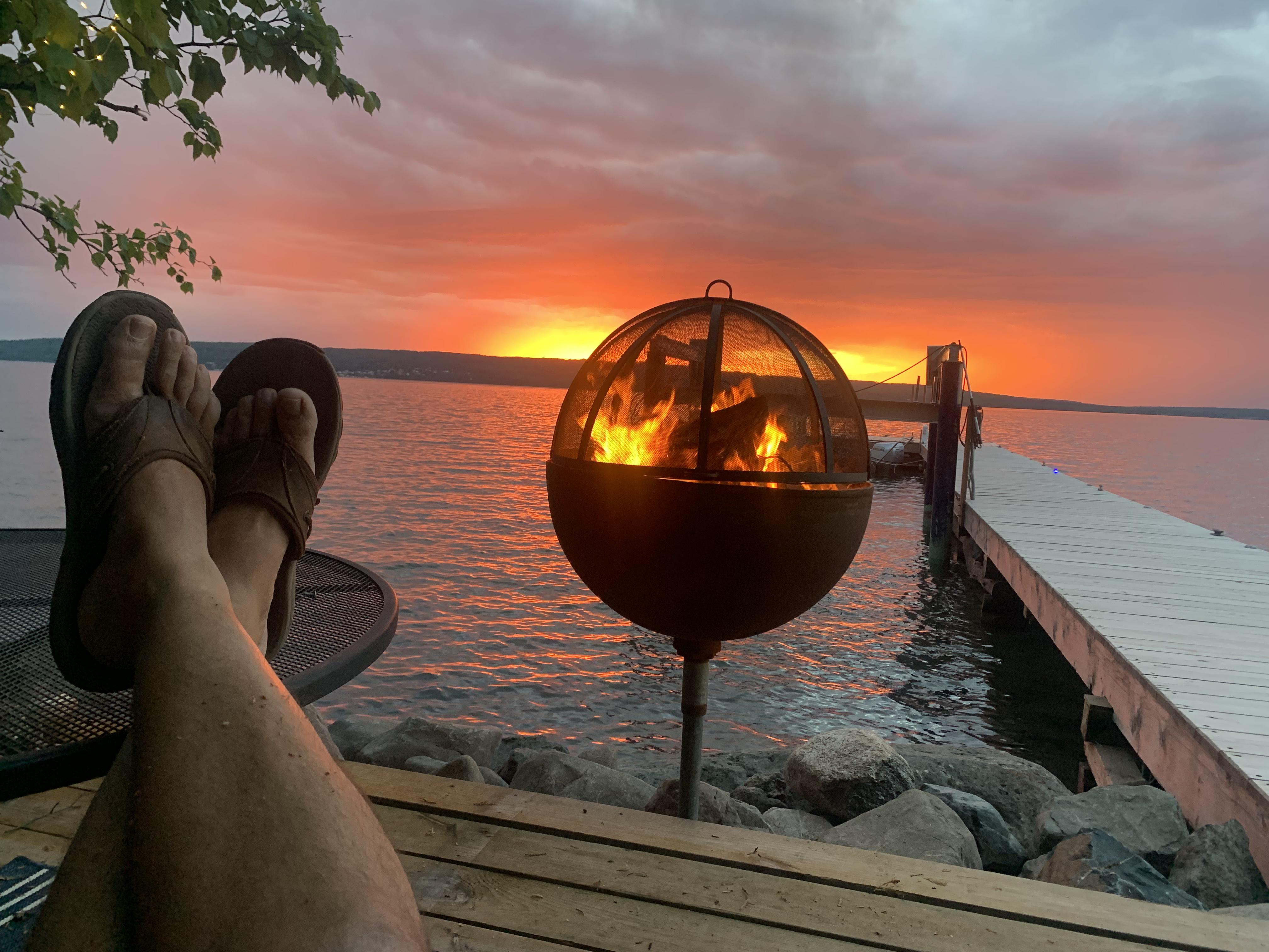 Sunset and bonfire over the lake