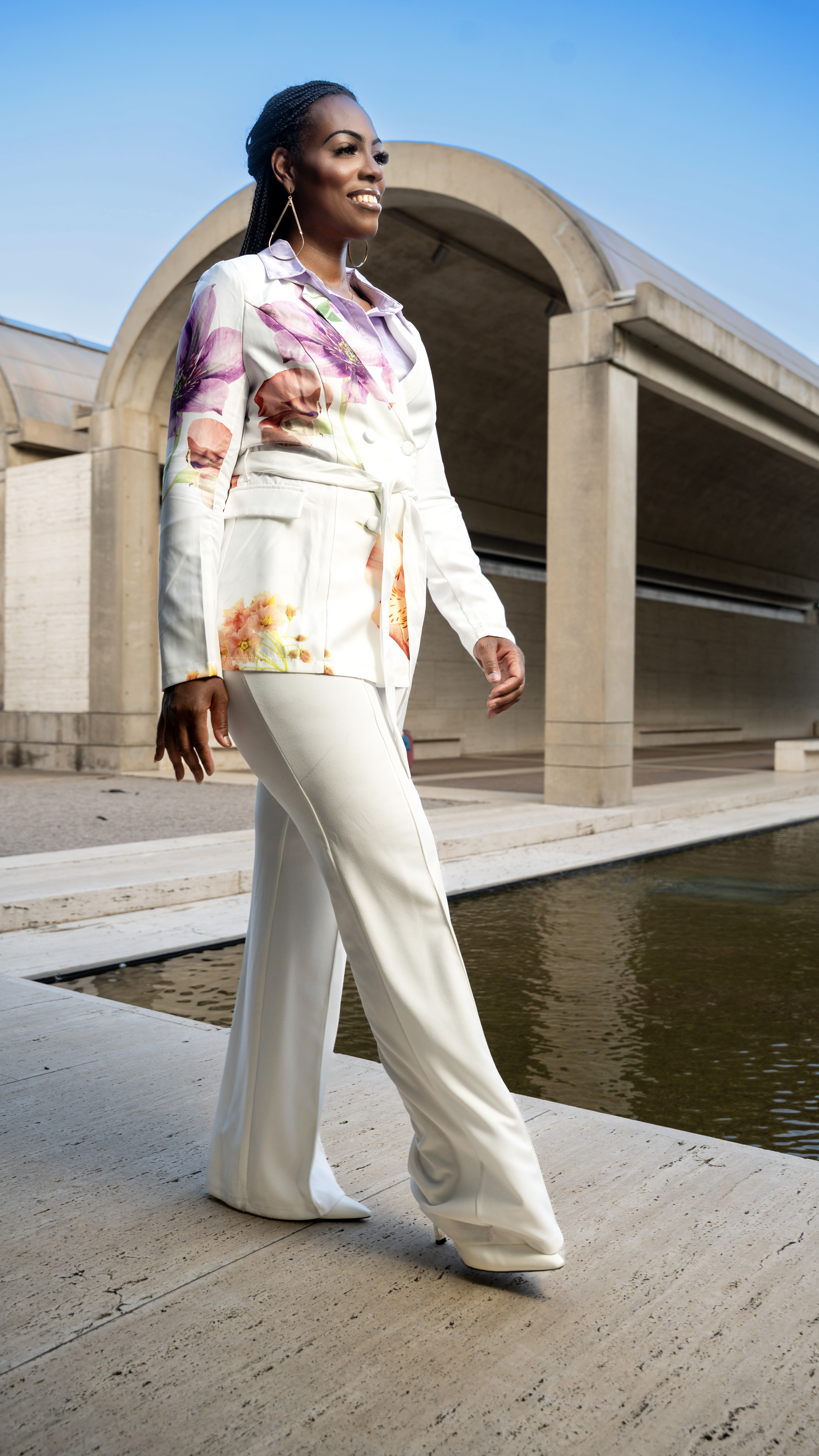 Editorial lifestyle photo of Britteny Brown smiling outdoors