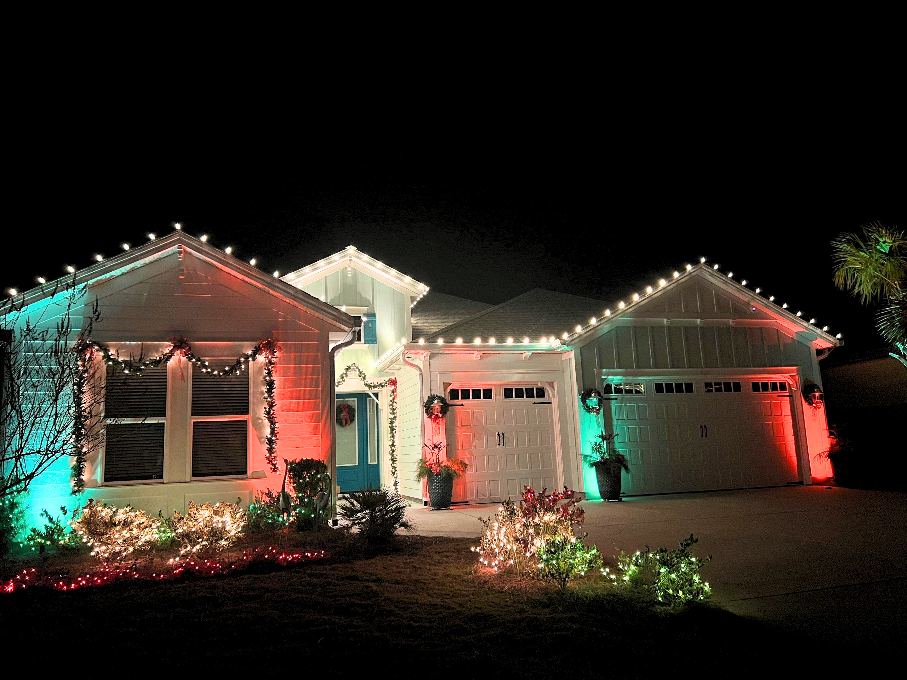 Outdoor holiday lighting display with warm white LED lights