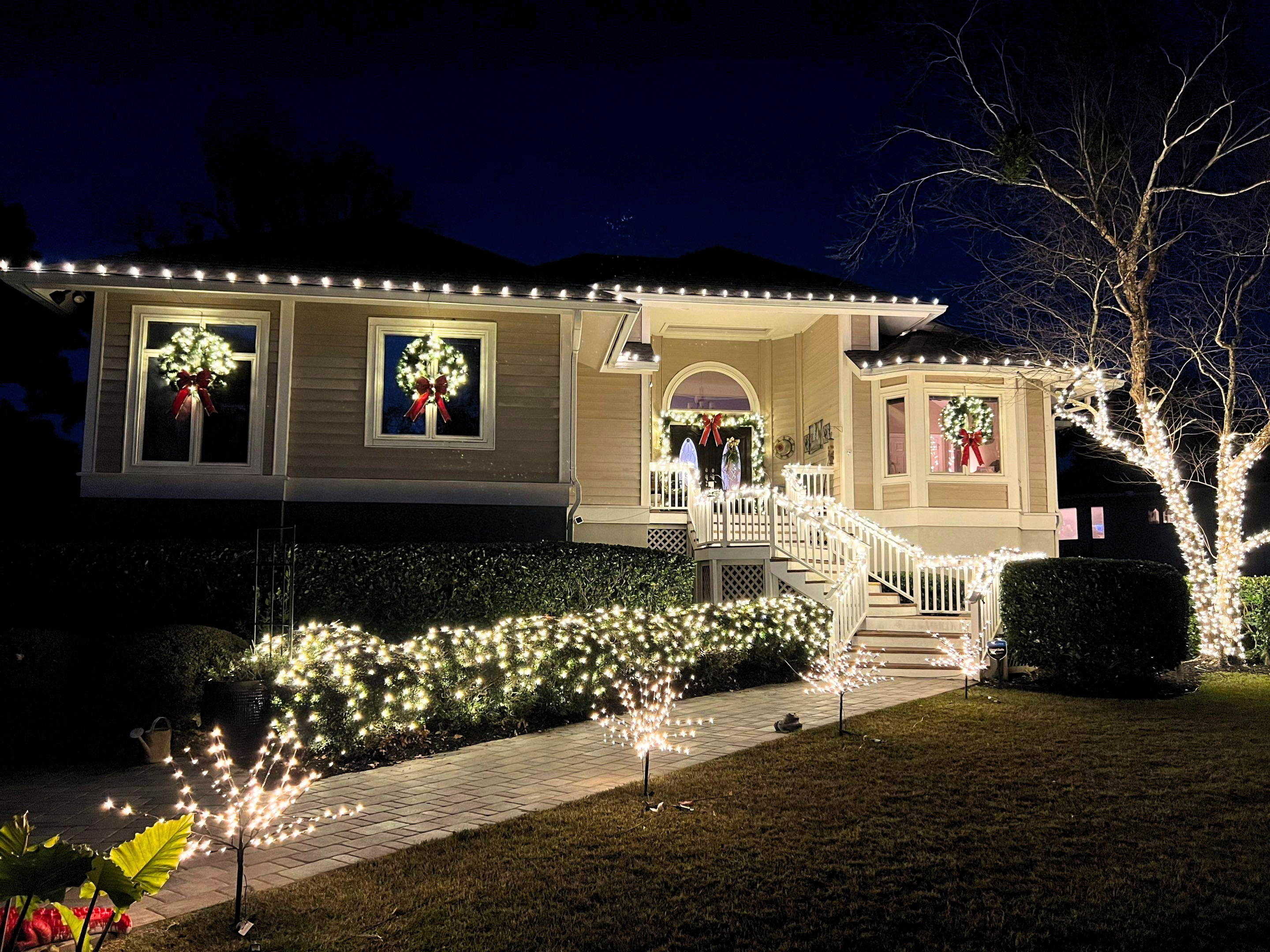 Christmas lighting installation on home exterior by Nightscapes Lighting in Bluffton SC