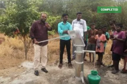 villagers from Erukkuvoy Village using their hand water pump