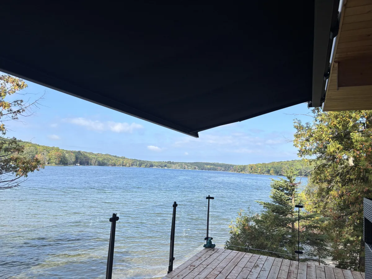 Awning over cottage patio with outdoor dining set