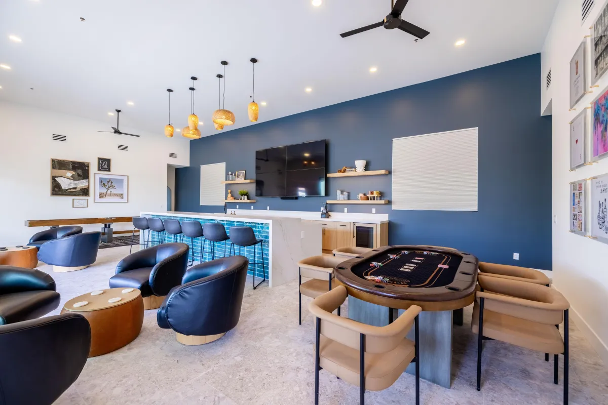 Modern game room with stylish lighting and comfortable chairs