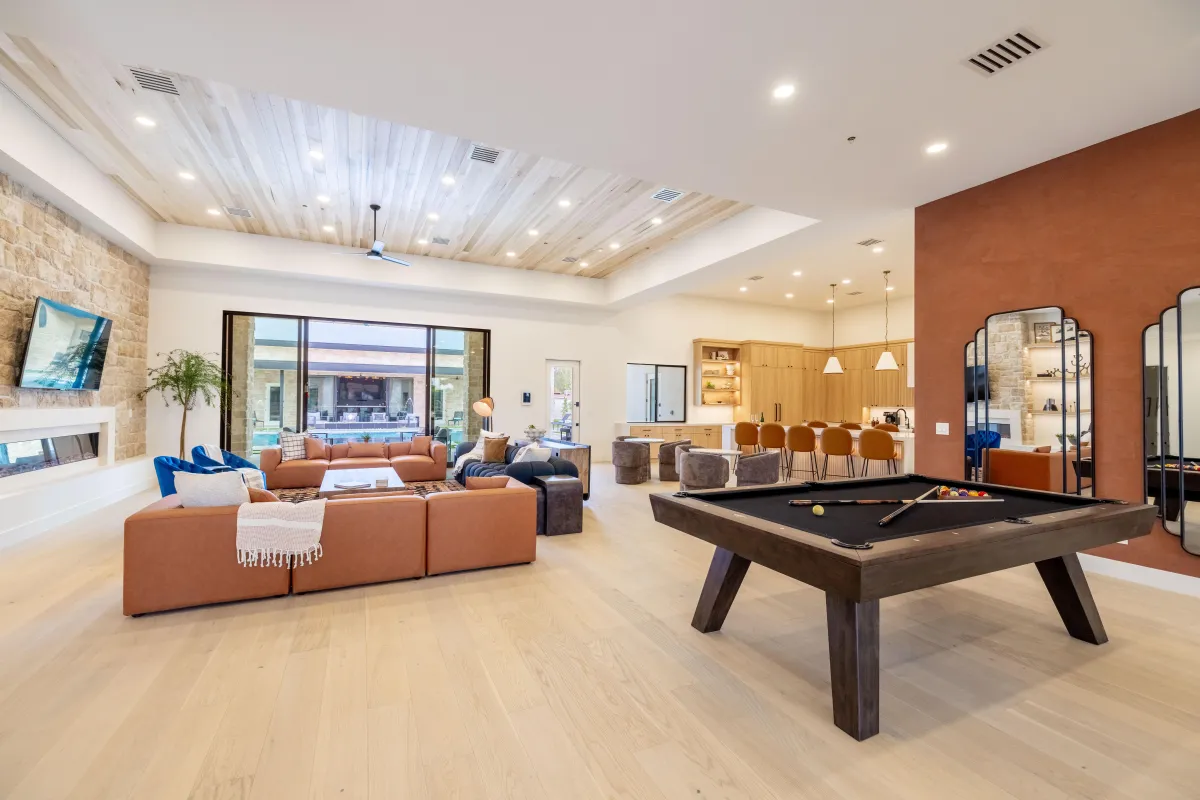 Spacious open-concept living room with plush sofas