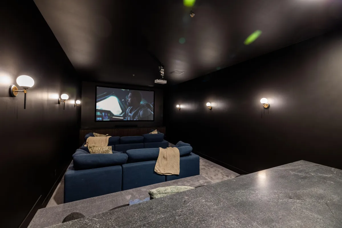 Private theater room with reclining chairs and surround sound