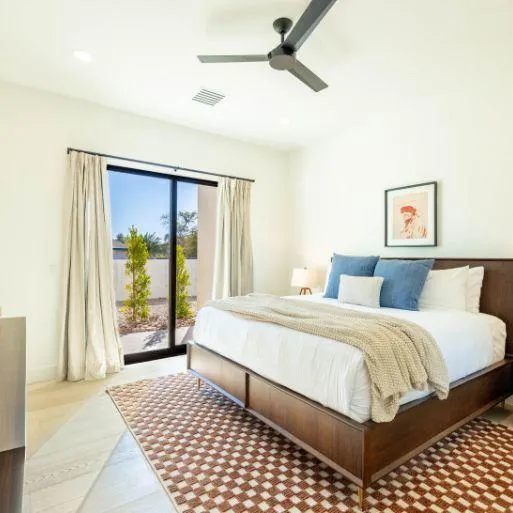 Master suite with luxurious bedding and spa-like ensuite bathroom