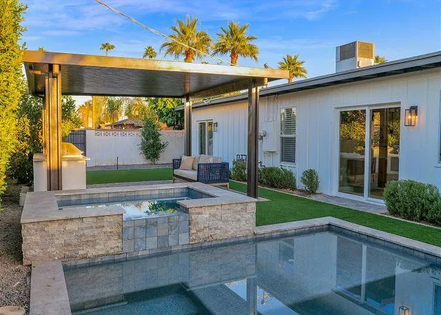 Outdoor seating area near the pool, perfect for entertaining guests