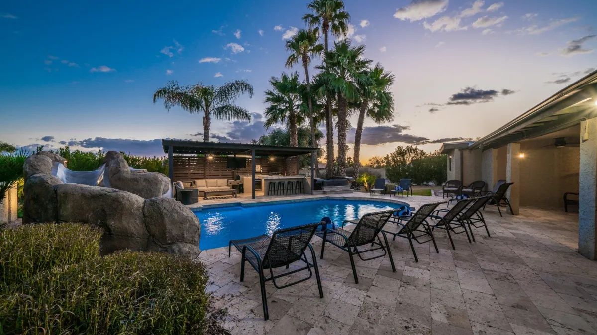 Outdoor seating area near the pool, perfect for entertaining guests