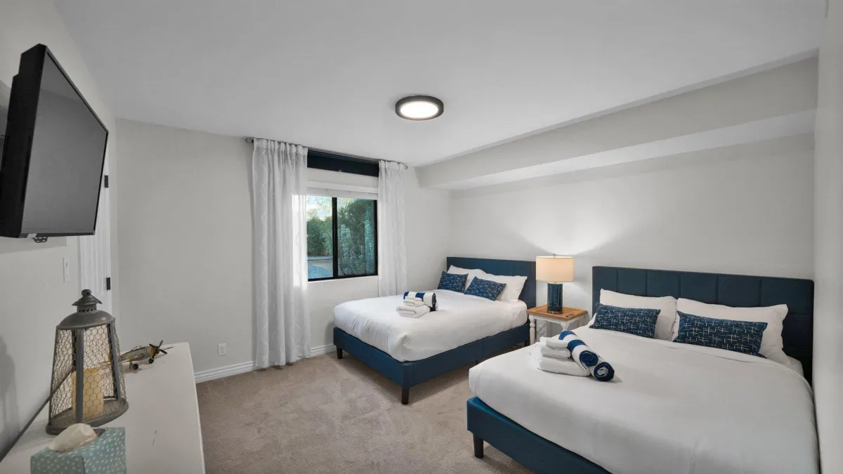 Bunk room with two full-size beds and fun decor