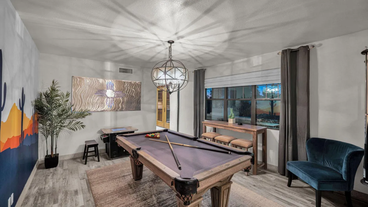 Game room with a pool table and arcade games