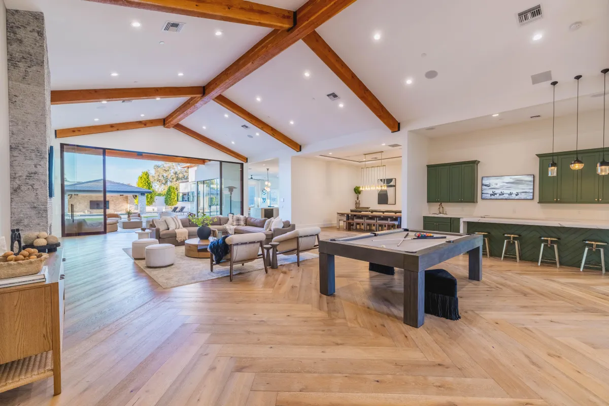 Elegant living room with modern furnishings and large windows 