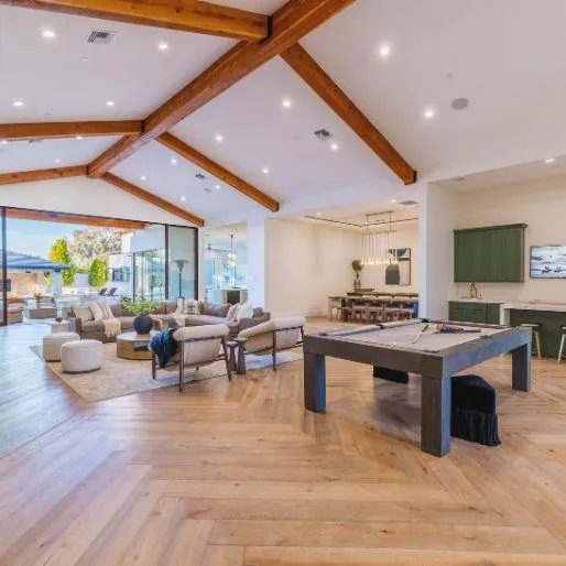 Elegant living room with modern furnishings and large windows 