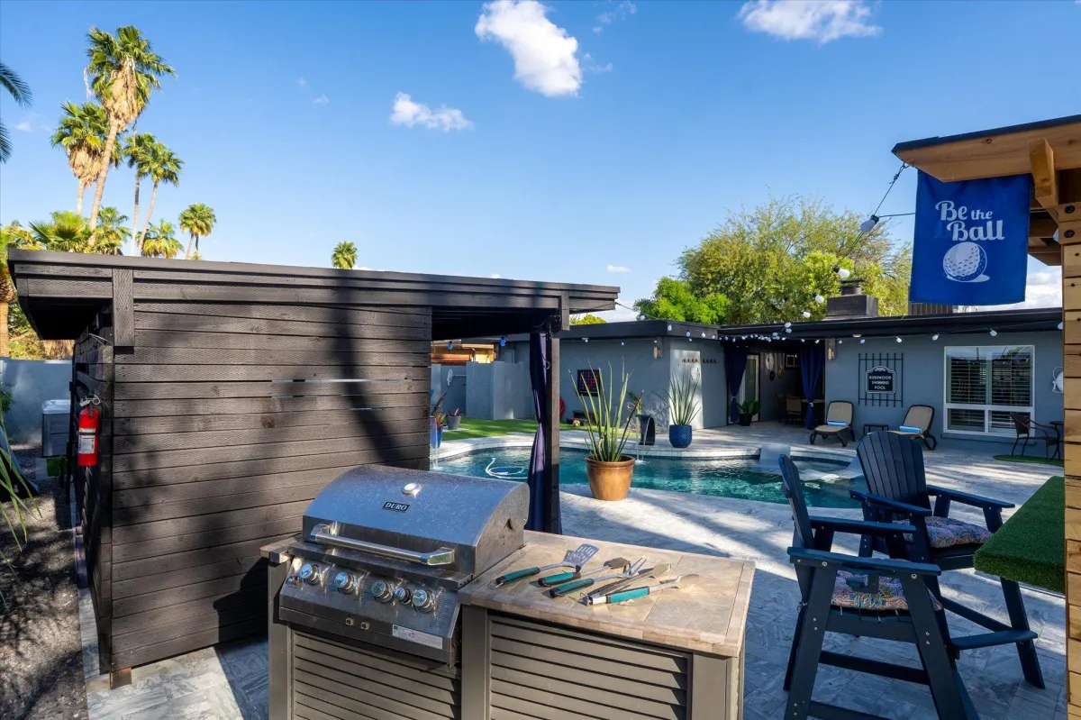 Outdoor seating with ceiling fan and tv