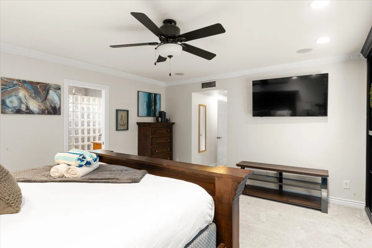 Master suite with luxurious bedding and spa-like bathroom