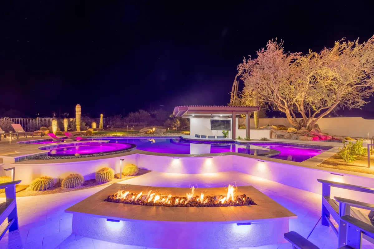 Luxury resort-style backyard with pool, spa, and sunken lounge at HÓZHÓ Scottsdale