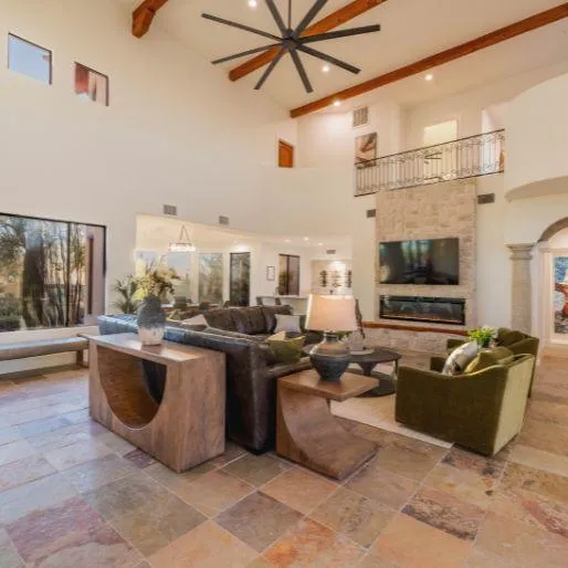 Elegant living room with modern furnishings and large windows 